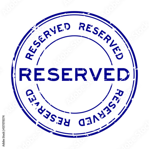 Grunge blue reserve round rubber stamp on white background