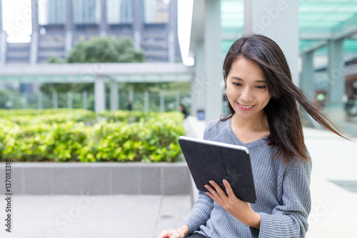 Woman use of tablet computer at Hong Kong city