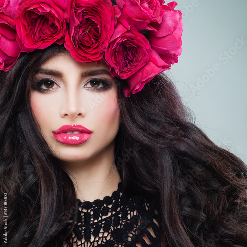 Glamorous Brunette Woman with Curly Hair and Roses Wreath