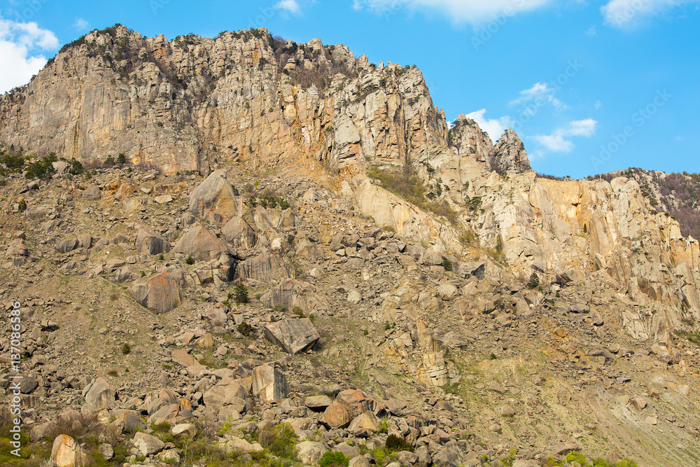 high mountain slope covered with small stones painted large expedition to the mountains