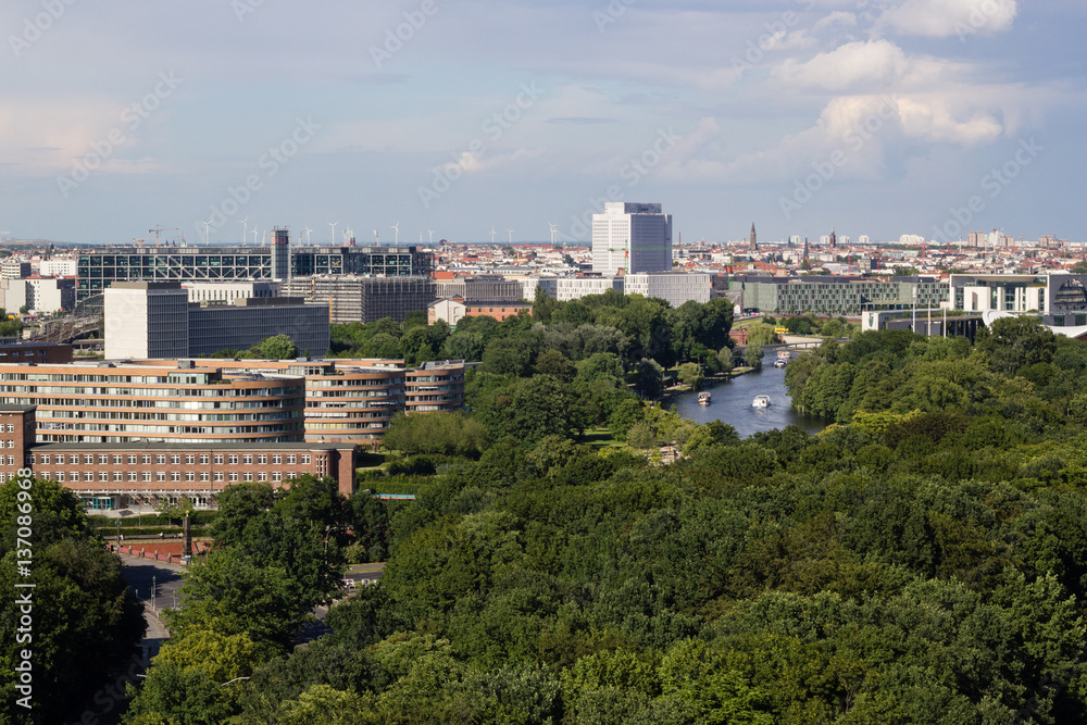 Cityscape of Berlin and road in Tiergarten park landscape in cloudy day Cityscape of Berlin and road in Tiergarten park landscape in cloudy day
