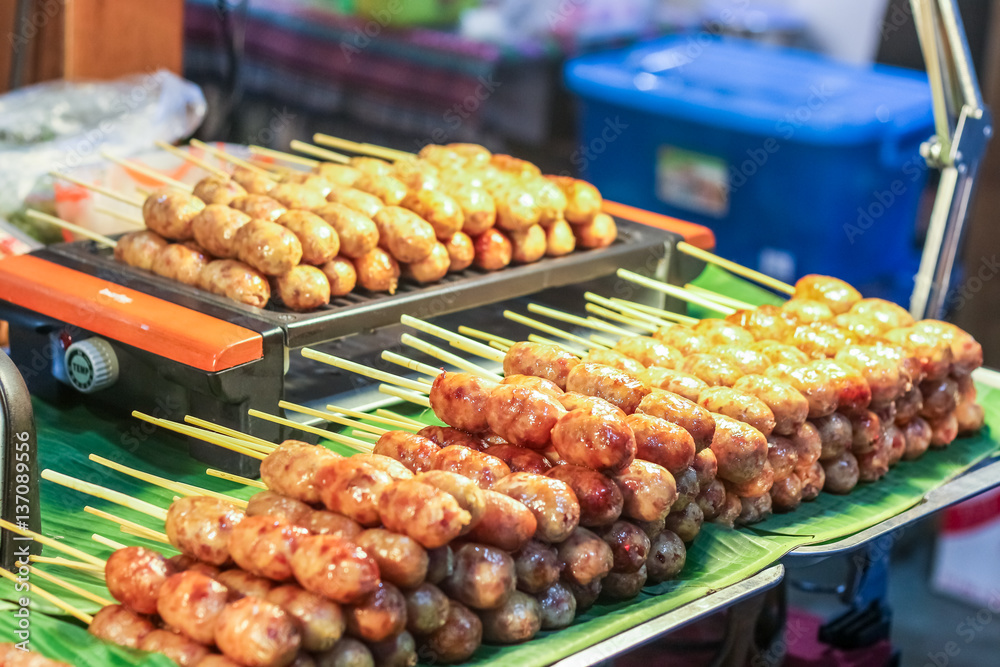 Thai style street food variety of grilled e-san sausage.