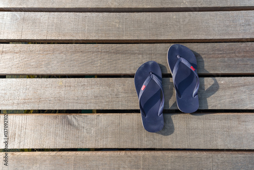 Slippers place on the wooden bridge at Ratchaprapha Dam at Khao Sok National Park, Surat Thani Province, Thailand. photo