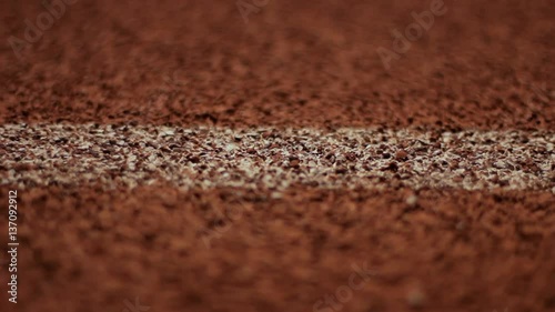 Extreme close up dolly of a starting line on a track.