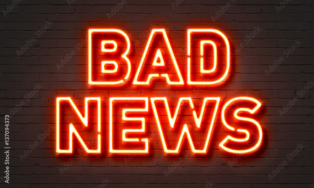 Bad news neon sign on brick wall background.