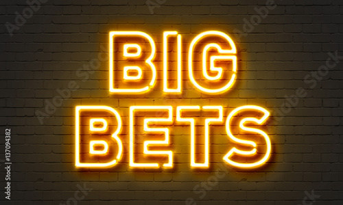 Big bets neon sign on brick wall background. photo