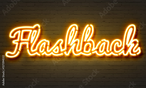 Flashback neon sign on brick wall background. photo