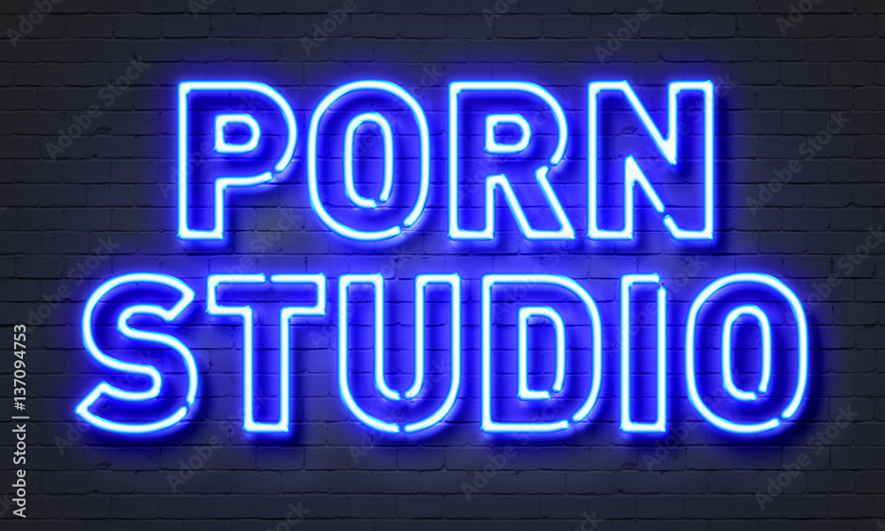 Porn studio neon sign on brick wall background. Porn studio neon sign on brick wall background.