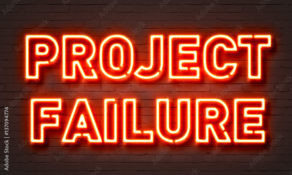 Project failure neon sign on brick wall background.