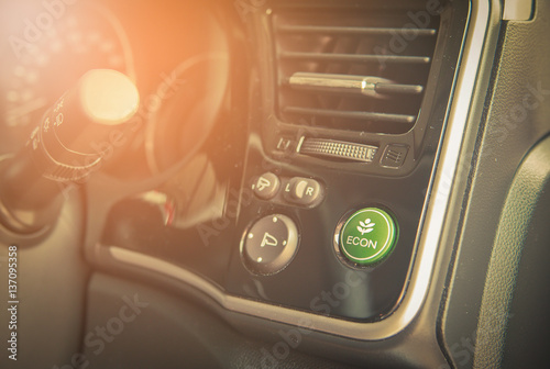 Closeup of Economic button in car. Vintage tone © nuttawutnuy