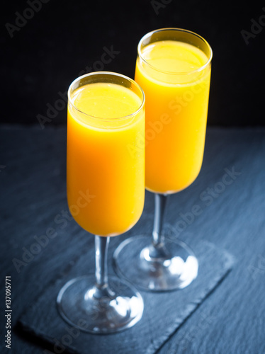 Freshly squeezed orange juice in champagne glasses