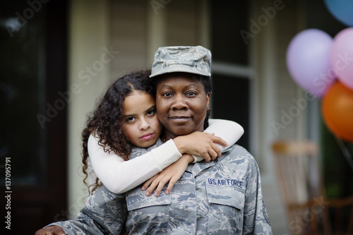 Portrait of girl with her military mother at party