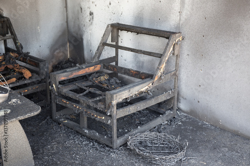 chair and furniture in room after burned by fire in burn scene