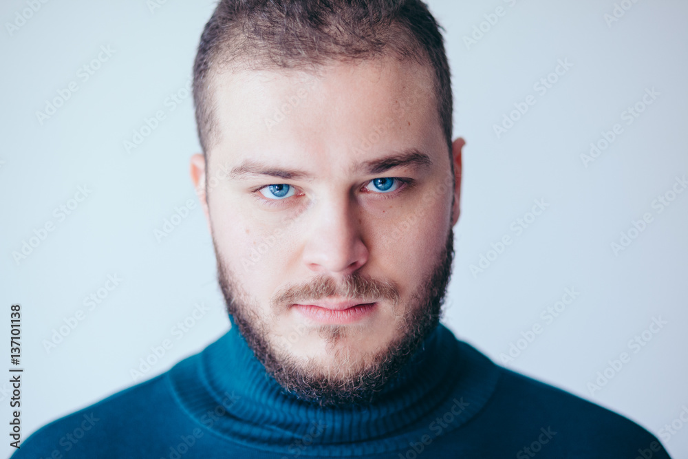Fototapeta premium Portrait of a handsome bearded young man
