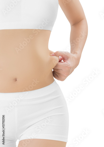 Woman checks and pinching Excess fat and grabbing skin on her flank seems like to be fat, overweight concept, Isolated on white background.