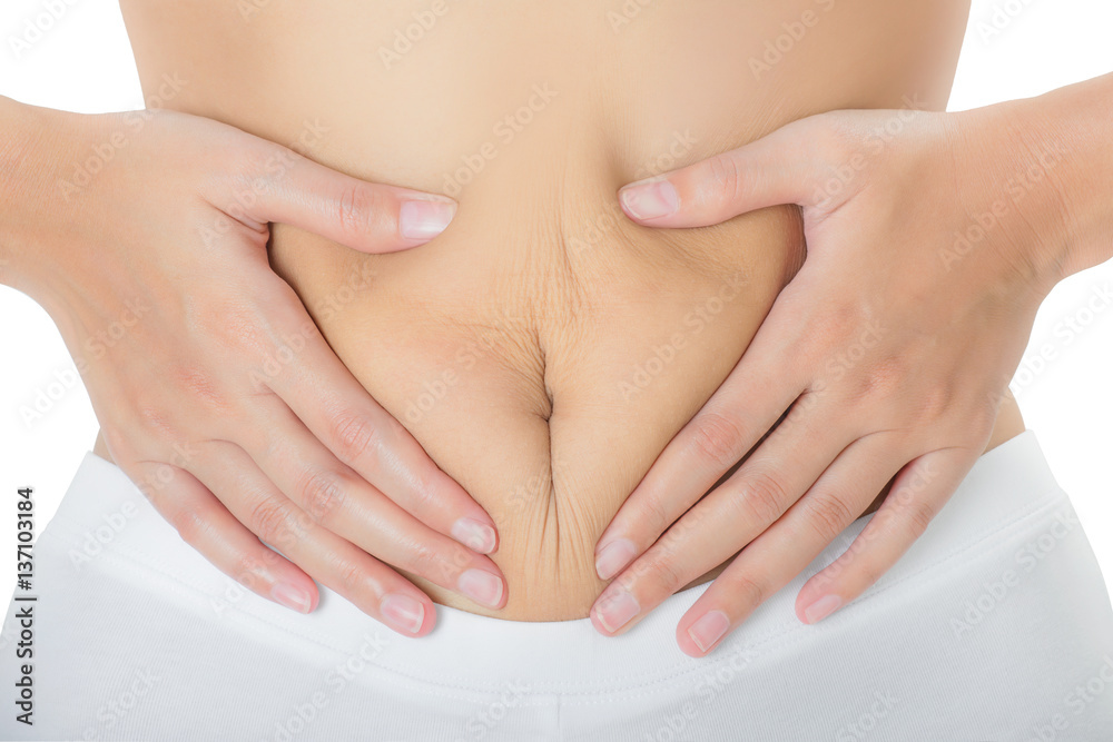 Woman checks and pinching Excess fat and grabbing skin on her belly seems like to be fat, overweight concept, Isolated on white background.