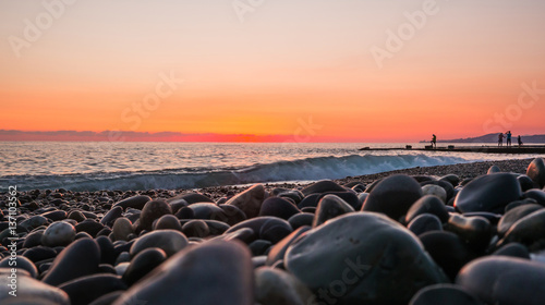 sunset on the beach. Shore of the Black Sea in Sochi, Russia
