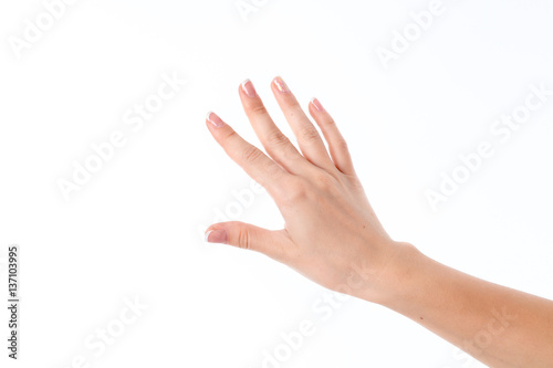 female hand stretched into the distance with your fingers is isolated on a white background © ponomarencko