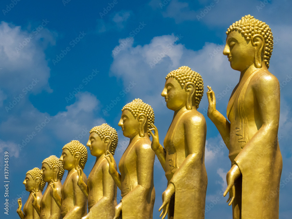 Series of Golden Yellow coloured standing Buddha statues collection with  hand Mudra at Nelligala International Buddhist Center Kandy, Sri Lanka  Stock Photo | Adobe Stock