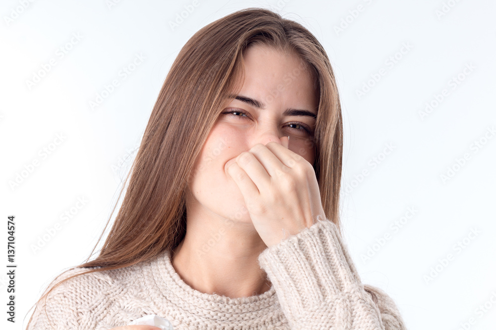 young girl holds hand up your nose is isolated on white background young girl holds hand up your nose is isolated on white background