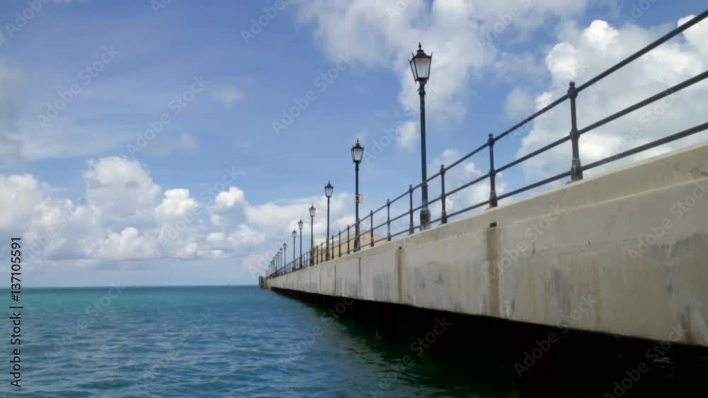 Quiet empty dock in the Royal Naval Dockyard in Bermuda. Quiet empty dock in the Royal Naval Dockyard in Bermuda.