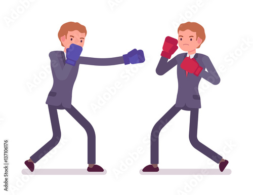 Two young businessmen boxing