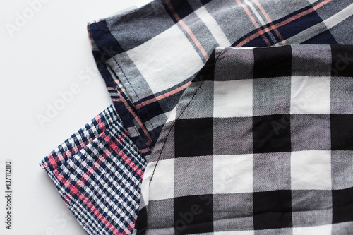 close up of checkered shirt on white background