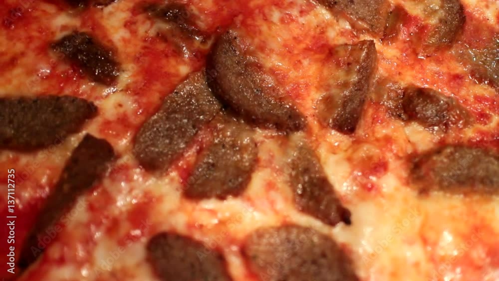 Extreme close up of a pizza with meatballs. Extreme close up of a pizza with meatballs.