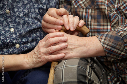 Old couple hands with cane © Petrik