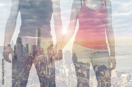 Double exposure of a couple in front of New York city