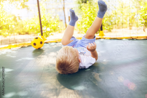 Wallpaper Mural Boy playing with a ball, jumping on a trampoline Torontodigital.ca