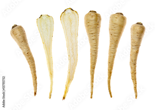 Six parsley roots on white background
