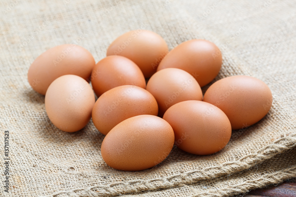 Chicken eggs on sack cloth Chicken eggs on sack cloth