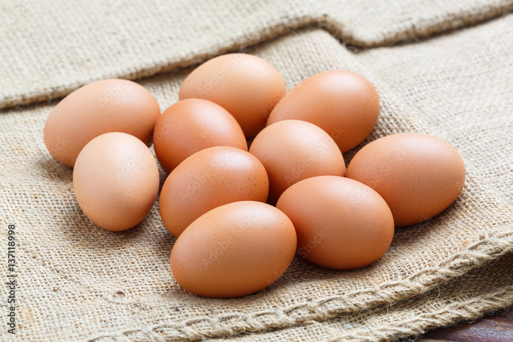 Chicken eggs on sack cloth Chicken eggs on sack cloth