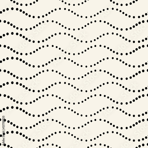 Abstract seamless pattern of various circles on a beige background.