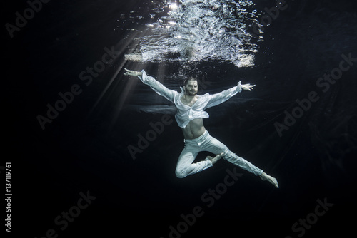young male ballet dancer unerwater