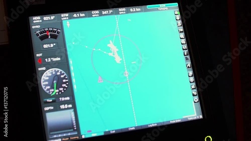 Instrument panel of ship in twilight, in lamplight. Close-up.