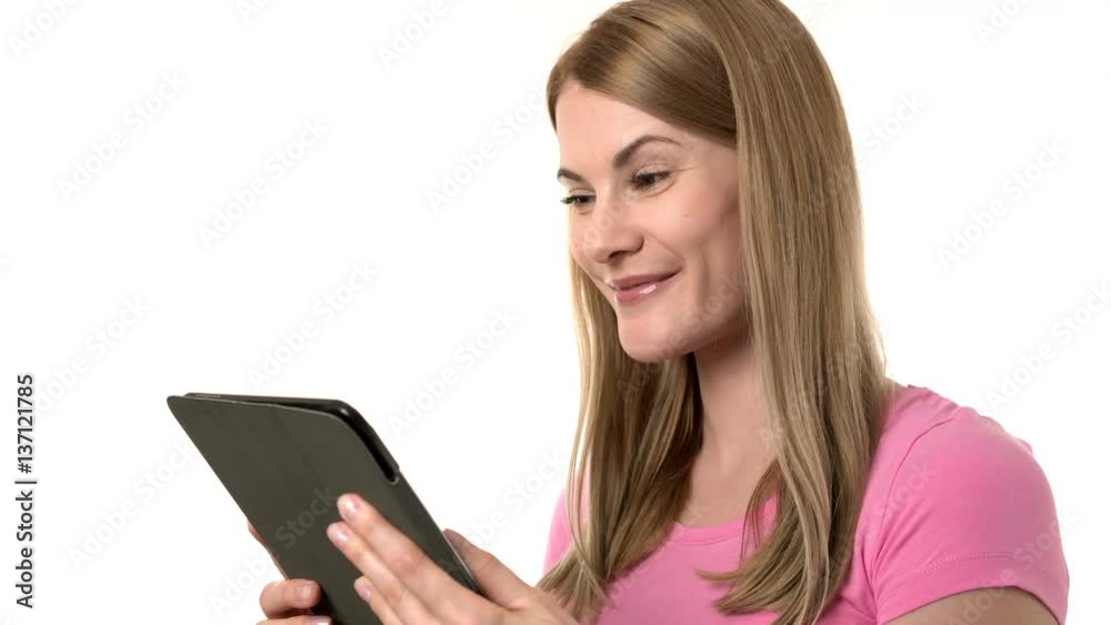 Beautiful woman with tablet. Browsing internet, communicating with friends. Isolated background.