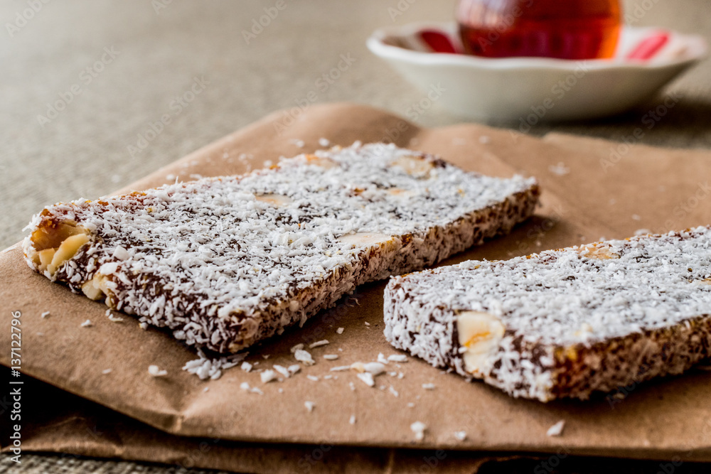 Turkish Dessert Cezerye with walnut, coconut powder and tea Turkish Dessert Cezerye with walnut, coconut powder and tea