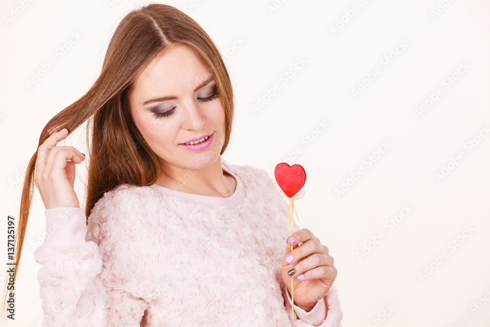Beautiful woman holding heart shaped hand stick Beautiful woman holding heart shaped hand stick