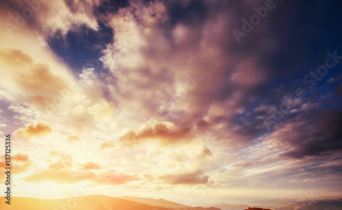 colorful sky with sun background in mountains. sunset, sunrise.