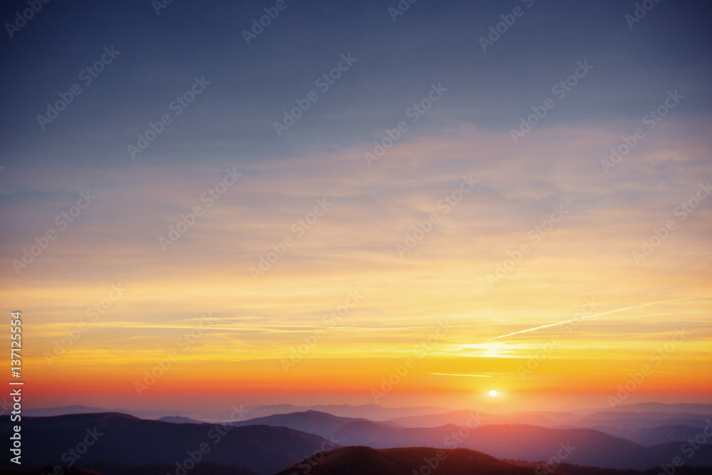 Fototapeta premium colorful sky with sun background in mountains. sunset, sunrise