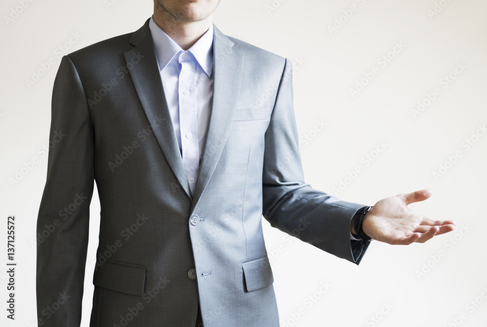 Photo of a businessman presenting something with empty space on ode side Photo of a businessman presenting something with empty space on ode side
