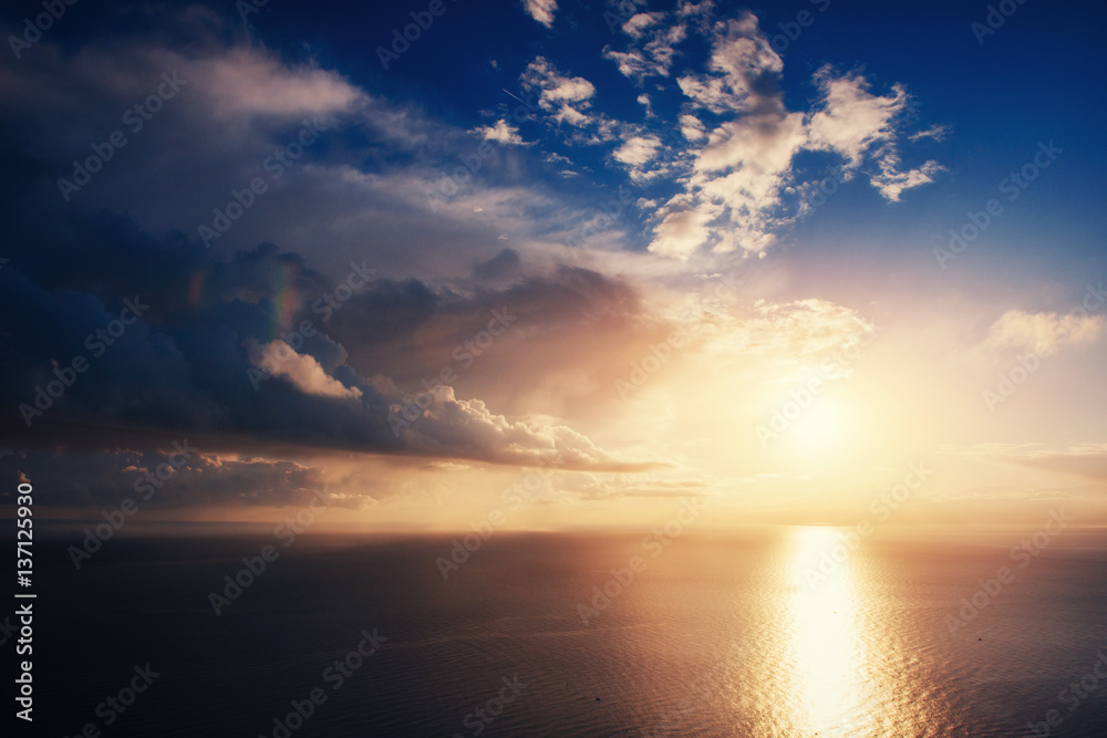 Fantastic view of the sky at sunset with cumulus clouds.