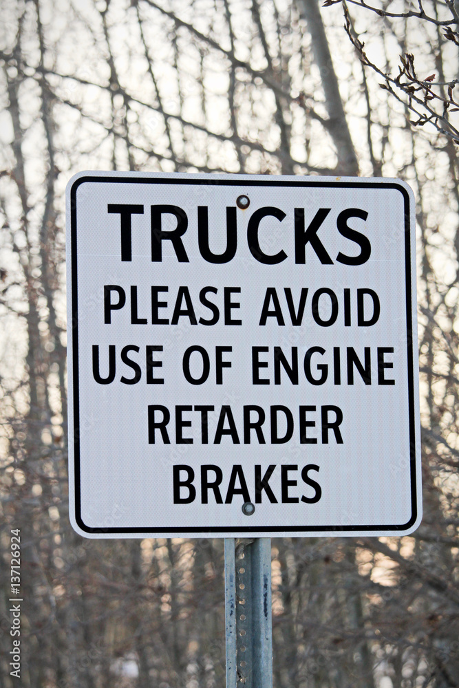 Close Up of Trucks Avoid Retard Brakes Sign Close Up of Trucks Avoid Retard Brakes Sign