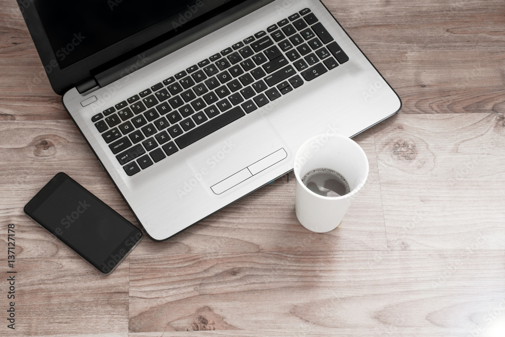 Office workplace with coffee and note book on wood table. Office workplace with coffee and note book on wood table.