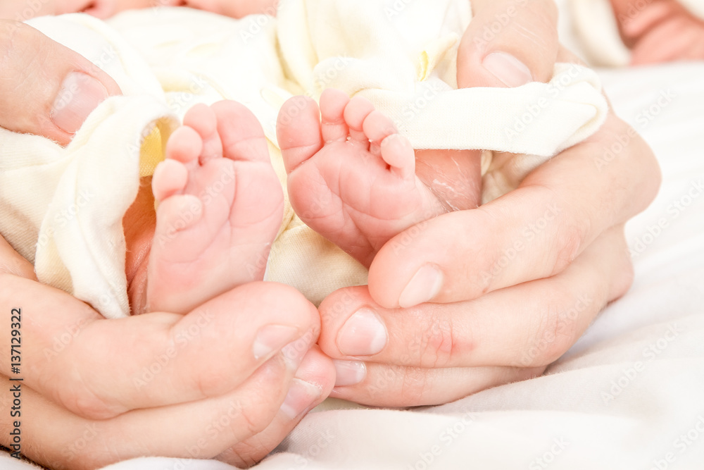 newborn baby in father's hands, indoor portrait newborn baby in father's hands, indoor portrait