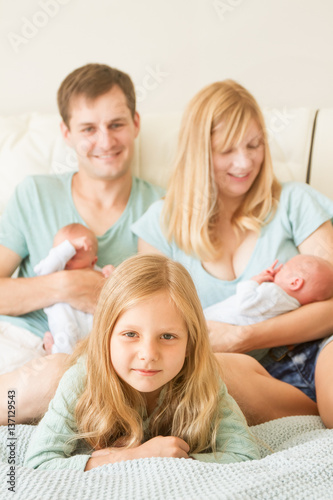 big family of 5 with older daughter and baby twins, indoor portrait at home