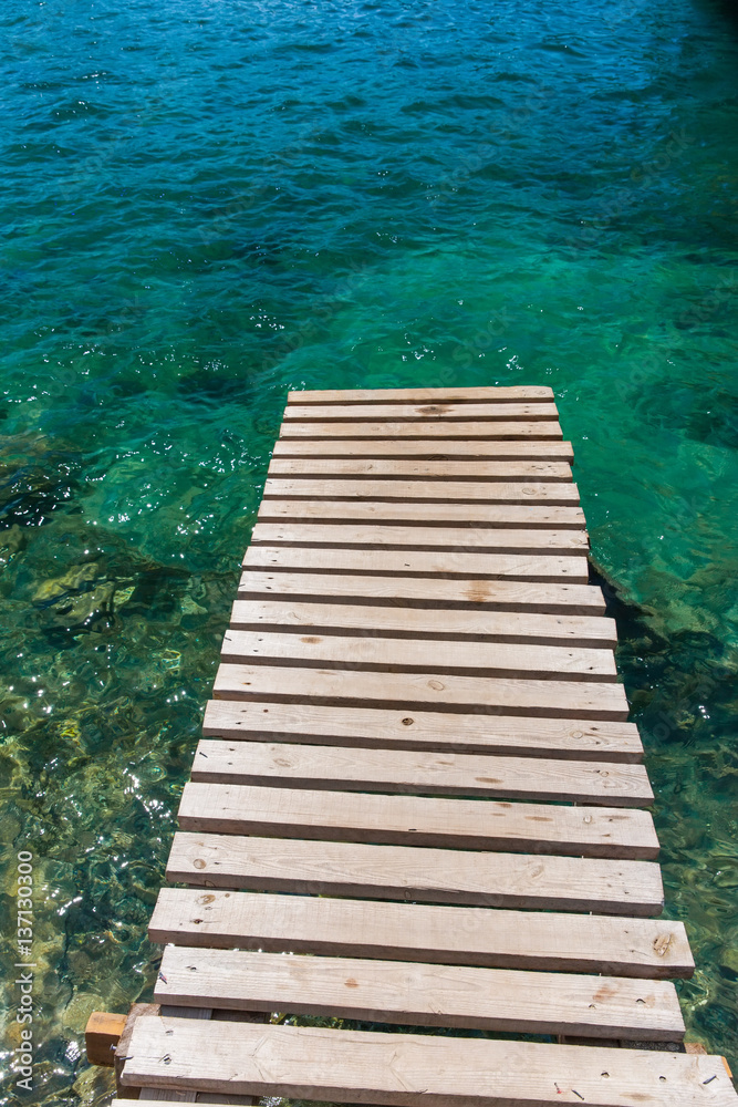 Fototapeta premium abandoned jetty on the background of sea