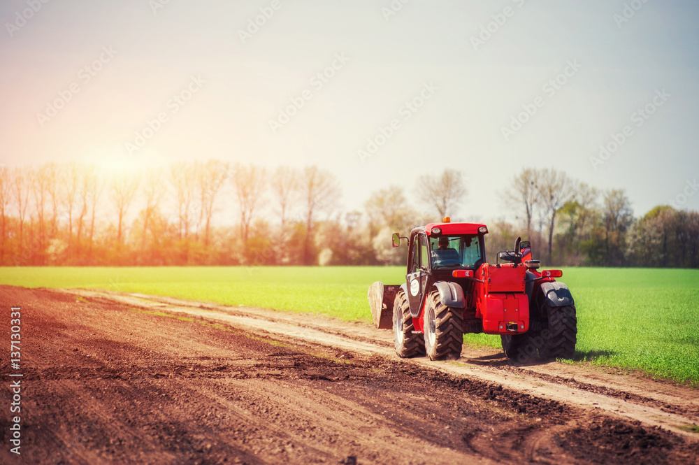 tractors working in the field. Carpathians Ukraine. Europe tractors working in the field. Carpathians Ukraine. Europe